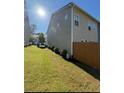 Well-maintained backyard with green grass, a fence, and low shrubs at 5726 Silver Lake Dr, Mableton, GA 30126