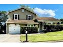 Charming home with a well-maintained lawn, an attached garage, and a cozy front porch at 6325 Stablewood Way, Lithonia, GA 30058