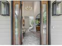Grand foyer with high ceilings, modern lighting, and elegant decor at 7540 Shadburn Ferry Rd, Cumming, GA 30041