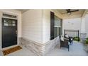 Cozy front porch with seating, stone accents, and an inviting entrance at 422 Laurel Spring Ct, Canton, GA 30114