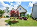 Attractive home exterior showcasing a well-maintained lawn and mature landscaping at 422 Laurel Spring Ct, Canton, GA 30114