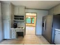 Kitchen featuring stainless steel refrigerator, grey cabinetry, and a view into another room at 5307 Red Rock Trce, Powder Springs, GA 30127