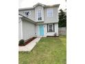 Well-maintained home with neat landscaping and a bright turquoise front door at 1754 Soapstone Ct, Decatur, GA 30034