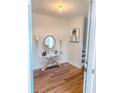 Bright foyer featuring wood floors, a stylish table, and decorative wall sconces at 1754 Soapstone Ct, Decatur, GA 30034