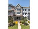 Inviting townhome exterior with a covered porch and fresh landscaping, offering great curb appeal at 281 Cherokee Ne St, Marietta, GA 30060
