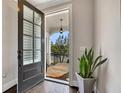 Warm entryway featuring a dark wood door, hardwood floors, and a view of the outdoor porch at 281 Cherokee Ne St, Marietta, GA 30060