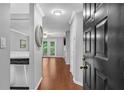 Entryway with coat closet, wood floors and stainless steel dishwasher at 3655 Habersham Ne Rd # 244B, Atlanta, GA 30305