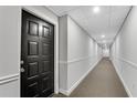 Interior hallway view showing the apartment door with unit number at 3655 Habersham Ne Rd # 244B, Atlanta, GA 30305
