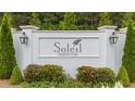 Elegant Soleil Belmont Park entrance sign set against manicured greenery at 438 Southland Cir, Canton, GA 30115
