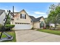 Lovely home featuring an attached garage and ample yard space at 121 St Albans Way, Peachtree City, GA 30269