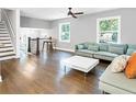 Spacious living room with light gray walls, hardwood floors, modern lighting, and lots of natural light at 2247 Green Forrest Dr, Decatur, GA 30032