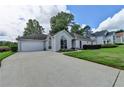 Lovely one-story home with an attached two-car garage and a large driveway at 500 Birch Forest Ln, Alpharetta, GA 30005