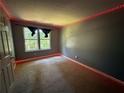 Cozy bedroom with soft carpet, natural light, and neutral wall paint at 2032 Hopkins Mill Road, Duluth, GA 30096