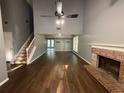 Spacious living room featuring hardwood floors, a fireplace, and high ceilings at 2032 Hopkins Mill Road, Duluth, GA 30096