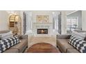 Inviting living room features a cozy fireplace, comfortable seating, and elegant decor at 1020 Regency Dr, Acworth, GA 30102