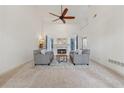 Bright living room with high ceilings, fireplace, ceiling fan, and neutral carpet at 1020 Regency Dr, Acworth, GA 30102