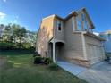 Side view of home with a well maintained lawn and landscaping at 1430 Lily Valley Dr, Lawrenceville, GA 30045