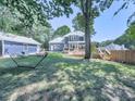 Expansive backyard with a deck, firepit, and plenty of space for entertaining at 173 Springwater Trce, Woodstock, GA 30188