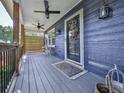 Charming covered front porch featuring a seating area and decorative accents at 173 Springwater Trce, Woodstock, GA 30188