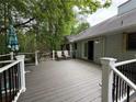 Spacious wooden deck with seating area, ideal for outdoor relaxation at 235 Creekside Way, Mcdonough, GA 30252