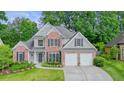 Beautiful two-story home with brick accents, a two-car garage, and lovely curb appeal at 4170 Haynes Mill Nw Ct, Kennesaw, GA 30144