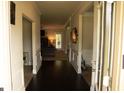 Grand entryway with hardwood floors, trim, and neutral color scheme at 305 Anise Ct, Mcdonough, GA 30252