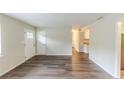 Spacious living room showcasing hardwood flooring, natural light and neutral wall paint at 3197 Ward Sw Dr, Atlanta, GA 30354