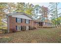Brick home on a landscaped lot, showcasing classic architectural details and curb appeal at 3497 Highway 5, Douglasville, GA 30135