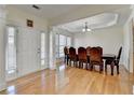 Welcoming entrance featuring hardwood floors and natural light, leading to the dining area at 645 Earlham Dr, Suwanee, GA 30024