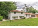 Charming two-story brick home with a well-manicured lawn and an attached two-car garage at 3275 Clifton Church Se Rd, Atlanta, GA 30316