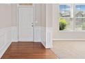 Inviting foyer features hardwood flooring and ample natural light at 4920 Fourth Rail Ln, Cumming, GA 30040