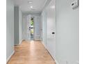 Light-filled hallway with wood-look floors and access to multiple rooms at 4771 Pinefield Nw Dr, Acworth, GA 30102
