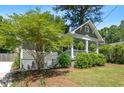Charming craftsman-style home with a welcoming front porch and lush landscaping, perfect for relaxing and enjoying the outdoors at 1116 United Se Ave, Atlanta, GA 30316