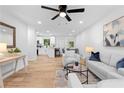 Open-concept living area boasts lots of light, modern decor, and a smooth transition to the dining area at 2849 Knotty Pine Ct, Buford, GA 30519