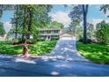 Two-story home with inviting front yard and driveway leading to the attached garage at 1206 Tred Avon Sw Way, Lilburn, GA 30047
