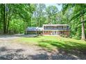 Charming two-story home with lush landscaping and a spacious front yard offering curb appeal and outdoor enjoyment at 1216 Oleander Sw Dr, Lilburn, GA 30047