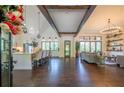 Bright, open-concept living space with wood floors, high ceilings, exposed beams, and a modern kitchen at 23 Sunset Se Rdg, Cartersville, GA 30121