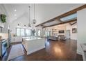 Expansive open-concept living area with wood floors, beamed ceilings, large windows, and a spacious kitchen at 23 Sunset Se Rdg, Cartersville, GA 30121