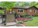 Close-up of a brick home entrance with landscaped garden bed and concrete stairway at 2511 Oak Ave, Tucker, GA 30084