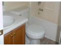 Clean bathroom with a combined shower and tub and classic wood vanity at 230 Happy Valley Church Rd, Dallas, GA 30157