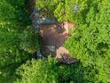 Bird's eye view of the home showcasing the roof and surrounding mature trees at 5800 Mitchell Rd, Atlanta, GA 30328