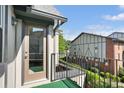 Balcony with a glass door entry, showing the balcony's railing and the exterior design at 6851 Roswell Rd # K-23, Atlanta, GA 30328