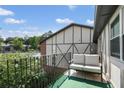 Relax on this cozy balcony with cushioned seating and treetop views at 6851 Roswell Rd # K-23, Atlanta, GA 30328