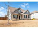 Inviting front of the house with lush lawn and an outdoor seating area at 1809 Hanwoo Ln, Powder Springs, GA 30127