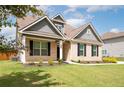 Well-maintained brick home features a pristine lawn and inviting front entrance at 1809 Hanwoo Ln, Powder Springs, GA 30127