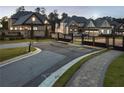 Gated community entrance showcasing elegant homes and meticulously maintained landscaping for premier living at 4253 Biltmore Pl, Marietta, GA 30062