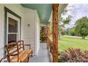 Inviting front porch with decorative accents and a cozy seating area at 7925 Silversmith Dr, Cumming, GA 30028