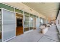 Wide angle of balcony leading to open glass doors to condo with concrete and glass accents at 890 Memorial Se Dr # 105, Atlanta, GA 30316