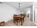 Charming dining area with wood table, matching chairs, and mirrored wall at 907 Parkaire Xing, Marietta, GA 30068
