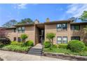 Attractive condo complex featuring well-maintained landscaping and inviting walkways at 907 Parkaire Xing, Marietta, GA 30068